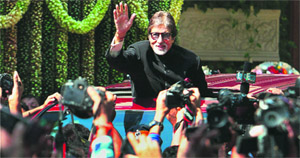 Amitabh Bachchan waves to his fans from his bungalow Jalsa on his 70th birthday in Mumbai on Thursday.