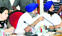 Deputy Chief Minister Sukhbir Badal (centre) meets Amritsar district officials