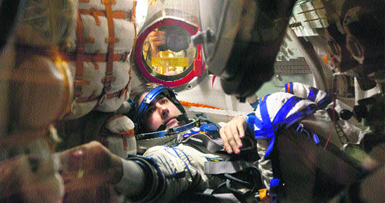 International Space Station (ISS) crew member Russian cosmonaut Evgeny Tarelkin is seen inside the Soyuz spacecraft during training at Baikonur cosmodrome on Wednesday.
