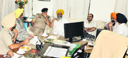 Police officers hold a meeting with SGPC officials in Amritsar on Friday. A Tribune photograph