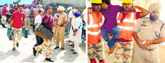 Participants of a three-day workshop, organised by the National Disaster Management Authority, conduct a mock rescue exercise at the District Transport Office in Amritsar on Friday. Photos: Vishal Kumar
