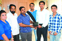 GM, BSNL, Amit Garg, hands over prizes to the winners of the quiz contest on Friday. Tribune photo: Pawan Sharma 