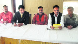 Members of the Lions and Lioness Club address the media in Mussoorie on Friday.