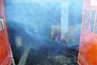 Smoke billows out of the engine room of the BSNL office at Kurli Bazaar in Mussoorie on Friday.