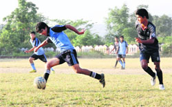 A match in progress during the Lala Nemi Dass Memorial Football League in Dehradun on Friday. Tribune photo: Vinod Pundir