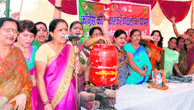 Members of the Mahila Morcha wing of the BJP stage a protest against the hike in the price of the LPG cylinder and its capping at Chandracharya Chowk in Haridwar on Friday.