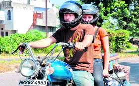 US nationals Aaron and Chauntelle move towards Dehradun as part of their global tour to generate awareness about global warming in Haridwar on Friday.