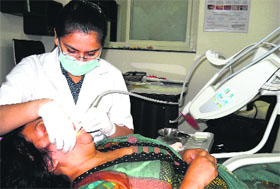 Dr Priyanka Virmani Bansal during a dental check up camp at Ranipur in Haridwar on Friday.