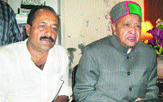 Virbhadra Singh addresses a press conference in Nurpur.