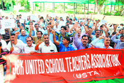 Members of the J&K United School Teachers Association stage a protest in Jammu on Friday. 