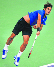 Roger Federer serves to Martin Cilic on Friday. 