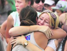Relatives of victims of the 2002 Bali bombing comfort each other during a commemoration service on the 10th anniversary of the incident in Bali.