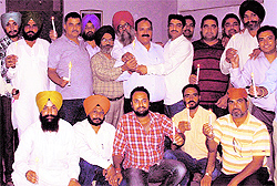 Members of Folklore Research Academy pray for the well-being of Malala Yousufzai, a Pakistani schoolgirl activist, who was shot at by the Taliban who campaigned for right to education, in Amritsar on Saturday