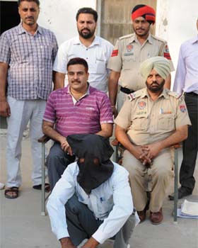 Police officials with the arrested accused