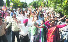 BJP workers rejoice at the victory in the Tehri byelection in Dehradun on Saturday. 