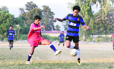 Players in action in a match during the Lala Nemi Dass Memorial Football Tournament in Dehradun on Saturday.