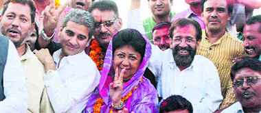 BJP candidate Mala Raj Lakshmi Shah, along with party leaders, celebrates her victory in Dehradun on Saturday.