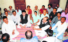 Sudhir Sharma at a meeting with Congress workers in Sidhbari near Dharamsala on Saturday.