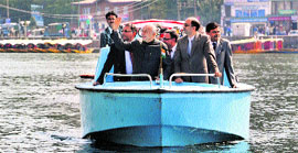 Home Minister Sushil Kumar Shinde enjoys a boat ride on the Dal Lake in Srinagar on Saturday.