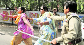 Police disperses protesting activists of the Jammu Kashmir Democratic Front in Jammu on Saturday.