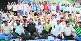 Members of the State Government Employees Joint Action Committee hold a protest in Jammu.