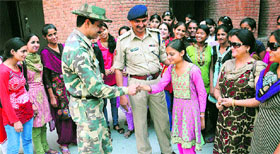 Students from Jammu and Kashmir with CRPF officials in Chandigarh on Saturday.