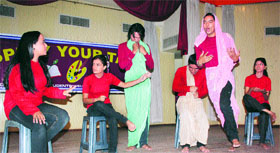 Students enact a scene of a play during the one-act play competition in Jammu on Saturday.