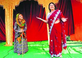 Navneet Kaur (right) and Neelam Colwin, playing the characters of Kaikai and Manthra, respectively, rehearse for the Ramlila in Sector 28, Chandigarh