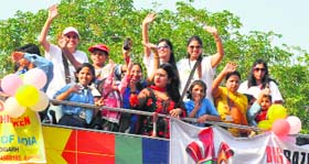 Speech and hearing-impaired children from the Jai Durga Deaf and Handicapped Children Welfare Centre take a ride on a bus on Sunday