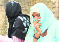 Rape victim along with her mother at Bijauli village in Yamunanagar district on Sunday.