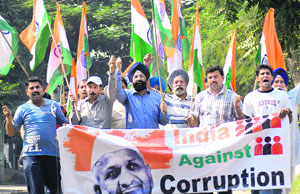 Volunteers of the India Against Corruption hold a protest march in Jalandhar on Sunday. 