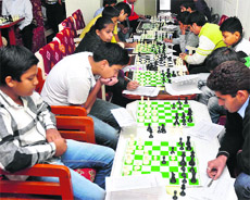Players in action during the Patnitop FIDE Rating All India Chess Championship at Hotel Mount Shivalik, Patnitop, on Sunday.