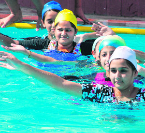 Students participate in the Annual Aquatic Meet 2012 at JK Public School in Jammu on Sunday.