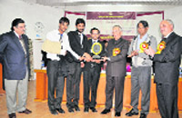 Participants of the law faculty, University of Kashmir, with their winning trophies in Srinagar on Sunday. 