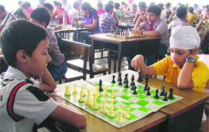 Players in action during the Ludhiana District Chess Championship in Ludhiana on Sunday.