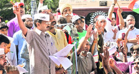 Arvind Kejriwal addresses a gathering in New Delhi on Sunday.