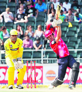 Sydney Sixers Moises Henriques (49*) hits through the covers on Sunday.