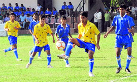 Players in action during the All-India Football Tournament at the Football Stadium, Sector 17, in Chandigarh on Monday.