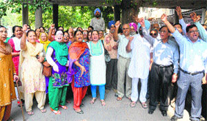 Residents of the Puncham Society, Sector 68, Mohali, hold a protest at the office of the Registrar, Cooperative Societies, in Sector 17, Chandigarh, on Monday.