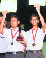 Winners from the YPS, Mohali, pose with the trophy after winning the city finals of the Limca Book of Records Quiz-2012 at Manav Mangal Smart School, Mohali, on Monday.