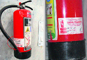 The fire extingusher, which expired on September 18, was replaced (right) by a new one at the Mansa Devi shrine on Monday. 