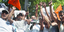 Auto drivers shout slogans during a protest at Jantar Mantar in New Delhi on Monday. Tribune photo: Mukesh Aggarwal