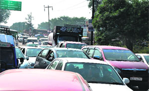 Traffic moves at a snails pace due to heavy rush on the occasion of Somwati amavasya in Haridwar on Monday. 