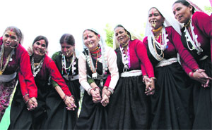 women in traditional attire perform a dance