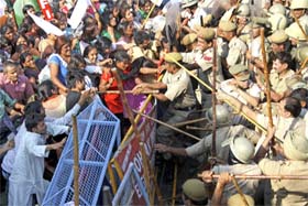 The police lathicharges protesting activists of various women outfits outside the Congress office at Ambedkar Chowk in Rohtak on Monday