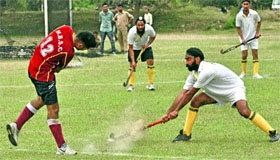 Players in action during the Inter-Collegiate hockey championship at the University of Jammu on Monday.