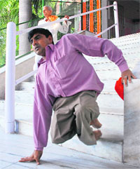 A physically challenged man uses the stairs at the Mansa Devi temple in Panchkula on Tuesday.