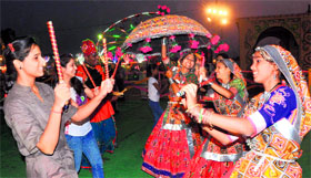 Visitors take part in dandiya at the Exhibition Ground in Sector 34, Chandigarh, on Tuesday.