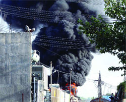A billow of smoke rising into the air from a power substation at Okhla in New Delhi on Tuesday. Tribune photo: Manas Ranjan Bhui