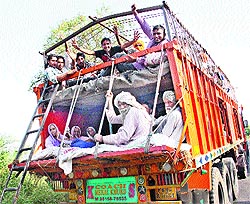 With the transport authorities looking the other way, such makeshift arrangements to accommodate more passengers are common in Haryana. This double-decker truck was photographed on the Jind-Rohtak highway on Tuesday